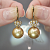 Earrings with golden South Sea pearls and diamonds