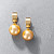 Earrings with golden South Sea pearls