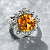 Ring with yellow sapphire and diamonds