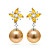 Earrings with golden South Sea pearls, sapphires and diamonds