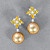 Earrings with golden South Sea pearls, sapphires and diamonds