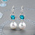 Earrings with South Sea pearls, Cambodian zircons, and diamonds