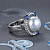 Ring with South Sea pearl, blue sapphires, and diamonds