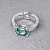 Ring with Teal sapphire and diamonds