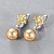 Earrings with golden South Sea pearls, sapphires and diamonds