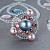 Ring with Tahitian pearl, freshwater pearl, malaya garnets, and diamonds