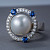 Ring with South Sea pearl, blue sapphires, and diamonds