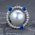 Ring with South Sea pearl, blue sapphires, and diamonds