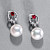 Earrings with South Sea pearls, spinel, and diamonds