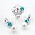 Earrings with South Sea pearls, Cambodian zircons, and diamonds