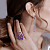Earrings with zircons, spinels, and diamonds