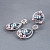 Earrings with Tahitian pearl, freshwater pearl, malaya garnets, and diamonds