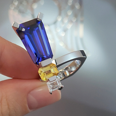 Ring with a yellow sapphire, tanzanite, and diamond