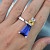 Ring with a yellow sapphire, tanzanite, and diamond