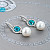 Earrings with South Sea pearls, Cambodian zircons, and diamonds