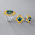 Ring with teal sapphires, yellow sapphires, and diamonds