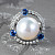 Ring with South Sea pearl, blue sapphires, and diamonds