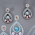 Earrings with Tahitian pearl, freshwater pearl, malaya garnets, and diamonds