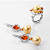Earrings with golden South Sea pearls, spessartite garnets, and diamonds