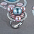 Ring with Tahitian pearl, freshwater pearl, malaya garnets, and diamonds