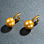 Earrings with golden South Sea pearls and diamonds
