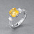 Ring with yellow sapphire and diamonds